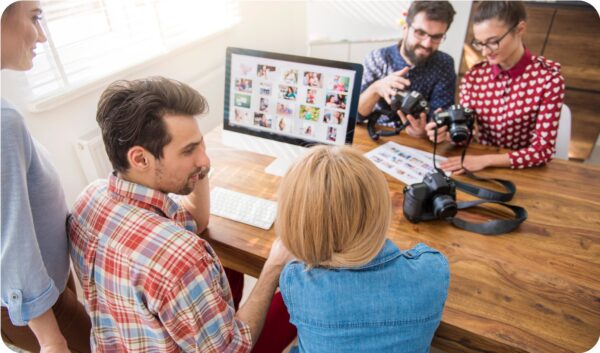 A team of co-workers sourcing images to master the art of visual blogging.